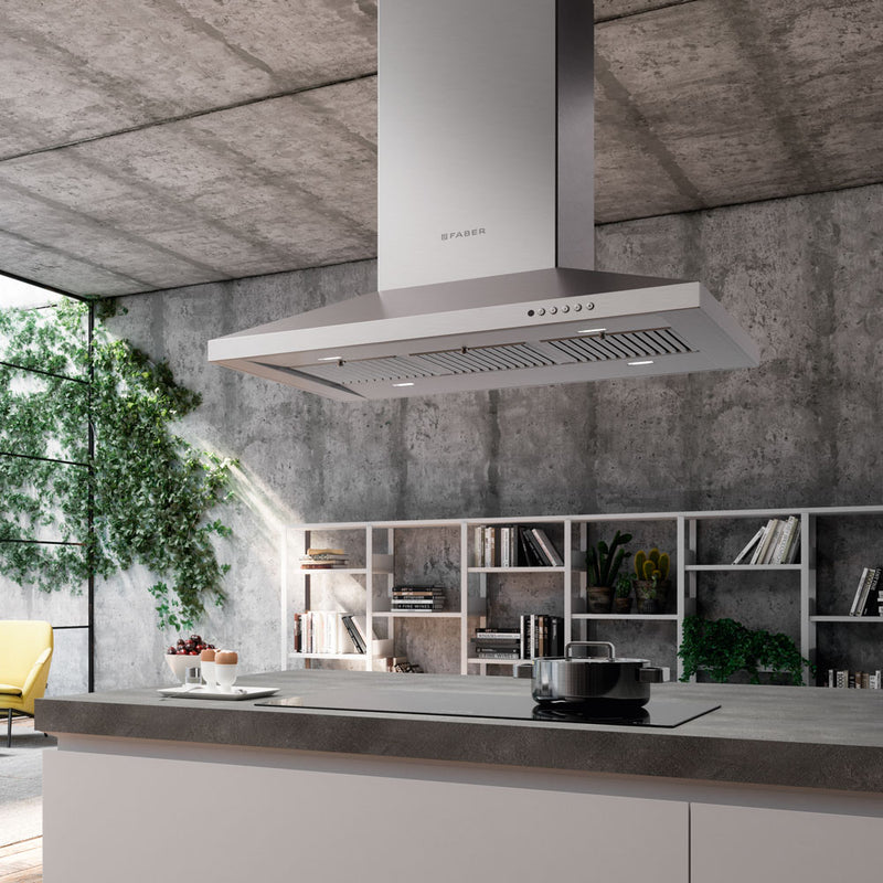 Faber stainless steel range hood over a large island in a modern industrial kitchen