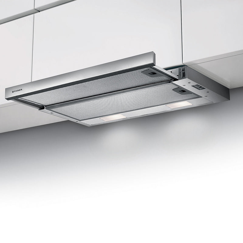 close up image of faber flexa integrated stainless steel kitchen hood in a minimalist lifestyle setting