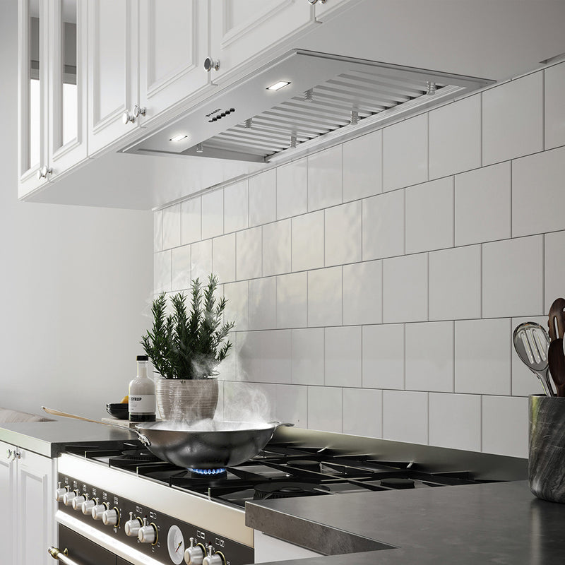 faber inca pro 18 industrial stainless steel kitchen insert range hood lifestyle image. clean, modern white kitchen settin