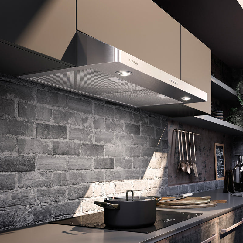 Industrial modern kitchen with grey brick backsplash featuring a Faber levante g kitchen range hood