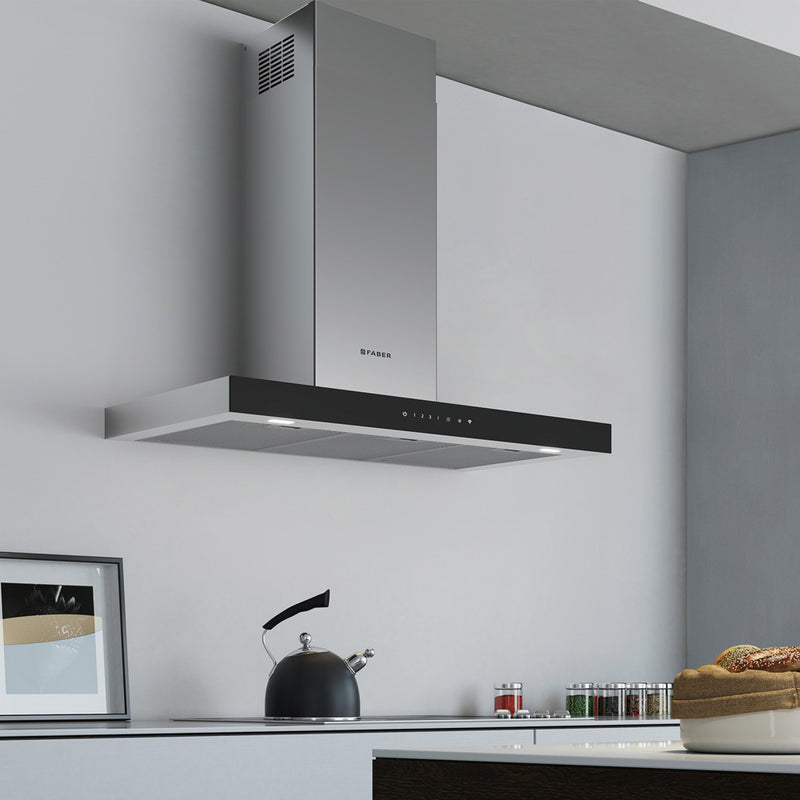 Modern grey kitchen featuring a Faber Stilo Glass Wall Range Hood