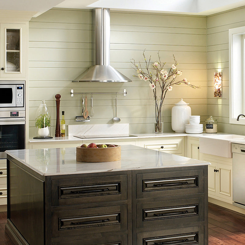 Farmhouse kitchen with large island and a stainless steel Faber wall range hood.