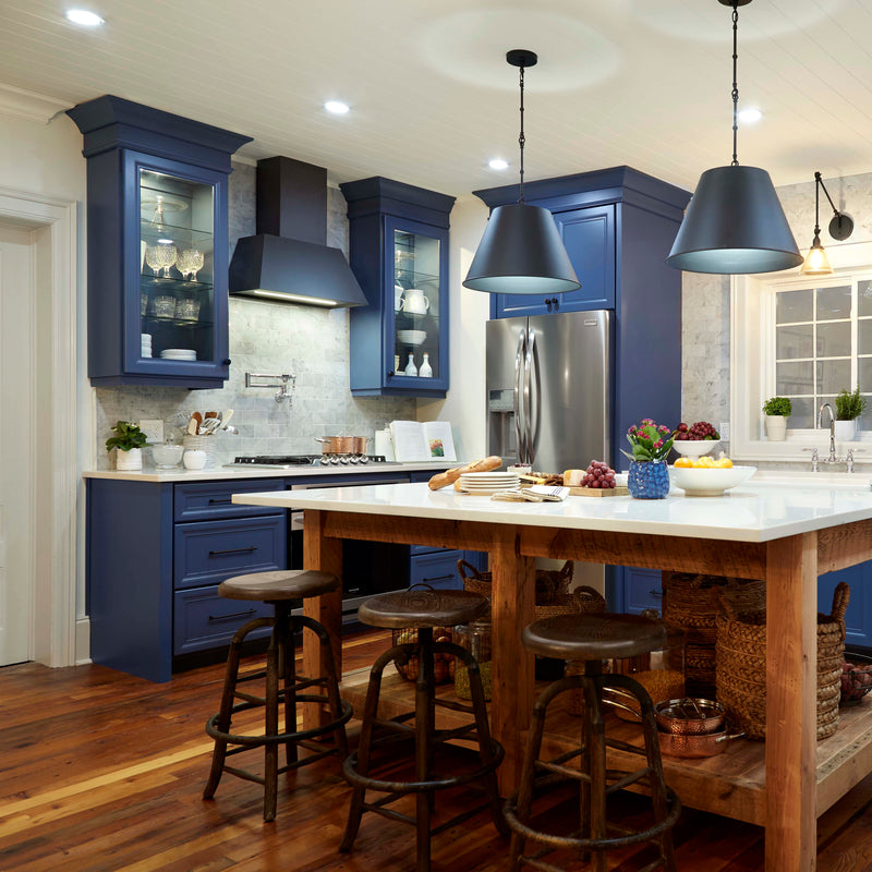 Faber Chloe hood in a modern farmhouse kitchen with deep blue cabinets and large island